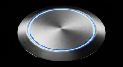 Bouton d'appel d'un interphone moderne au design épuré.